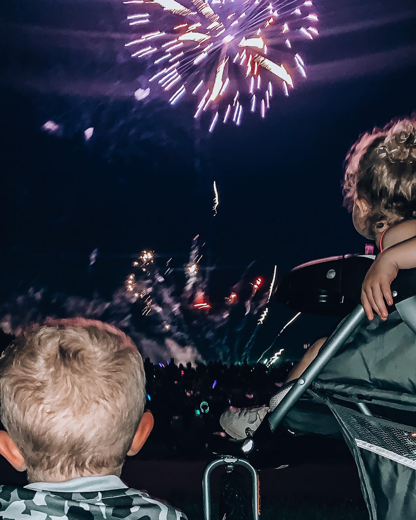 two kids watching fireworks