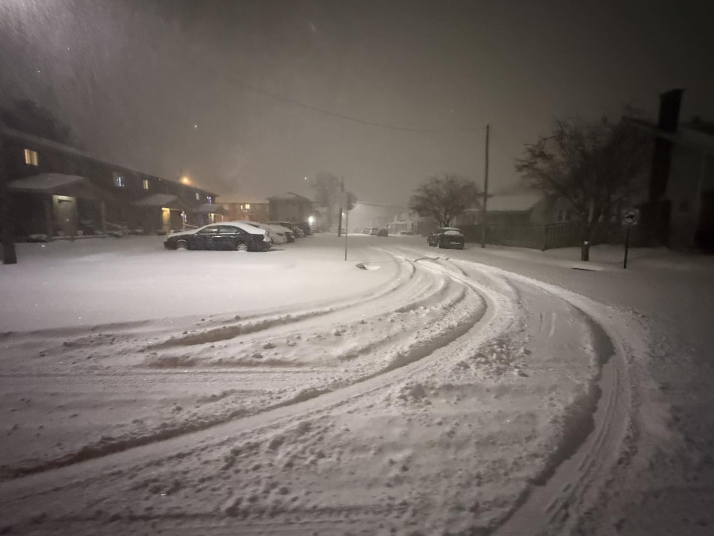 Drafted show in parking lot of apartment complex at night