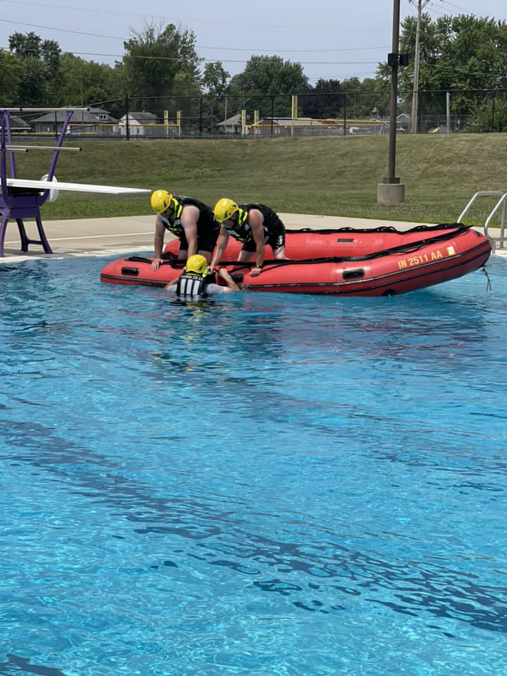 Two People on a Raft in a Pool