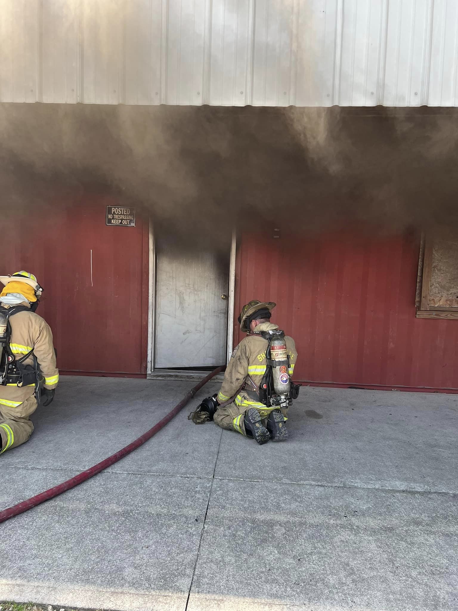 Smoke Billowing out of White Door