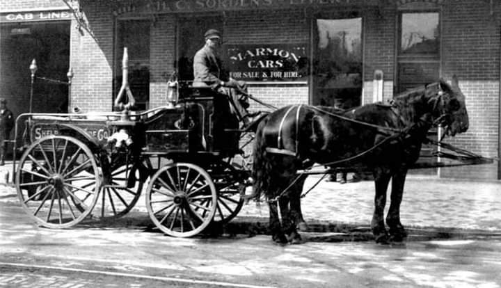 Firefighter on Horse Pulled Carriage 1
